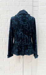 Load image into Gallery viewer, back view of the porto songbird jacket. This jacket is black with a blue scarab newspaper letter print. 

