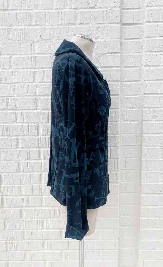 left side view of the porto songbird jacket. This jacket is black with a blue scarab newspaper letter print. The jacket also has a zip up front, a collar, and two front pockets.