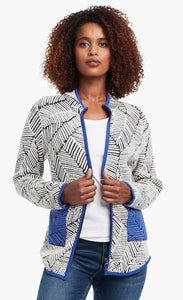 Front view of a woman wearing open the Nic+Zoe New Leaf Jacket. The zip up jacket has a black and white leaf pattern and blue trim with two front blue patch pockets.