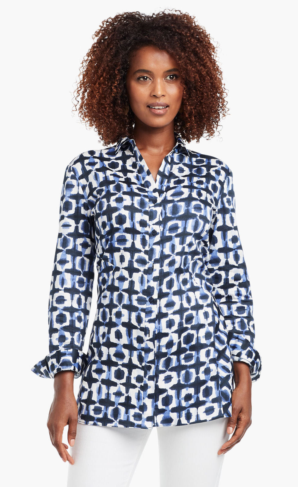 Front view of a woman wearing the Nic+Zoe Stretch Shibori Blouse. This indigo shibori printed shirt has a button down front, 3/4 length cuffed sleeves, and a collar.