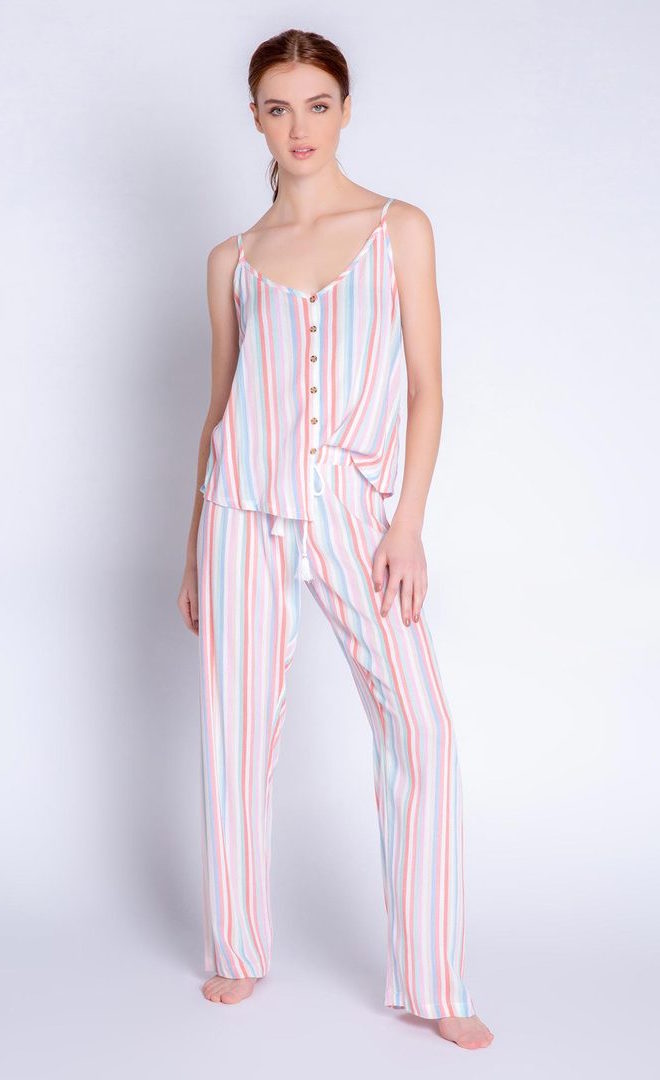 Front full body view of a woman wearing the saturday morning stripe set. This set includes the saturday morning stripe tank and the saturday morning stripe pant. This pj set is multicolored striped.