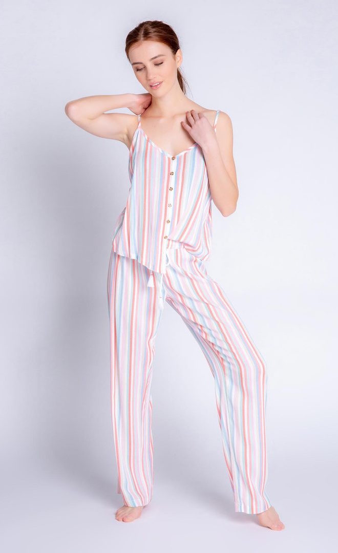 Front full body view of a woman wearing the saturday morning stripe set. This set includes the saturday morning stripe tank and the saturday morning stripe pant. This pj set is multicolored striped.