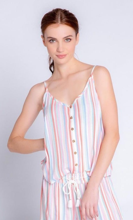 Front top half view of a woman wearing the saturday morning stripe tank. This tank has a button down front, thin straps, and a v-neck.