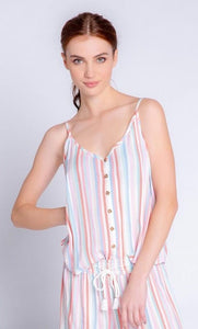 Front top half view of a woman wearing the saturday morning stripe tank. This tank has a button down front, thin straps, and a v-neck.