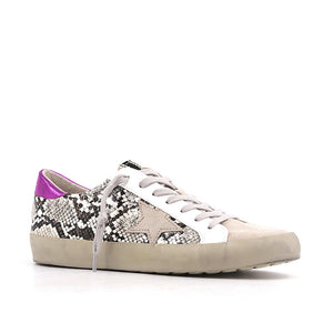 Outer front side view of the shushop paloma sneaker. This sneaker is taupe with snake print sides, a fuschia pink, back and a lace up front 