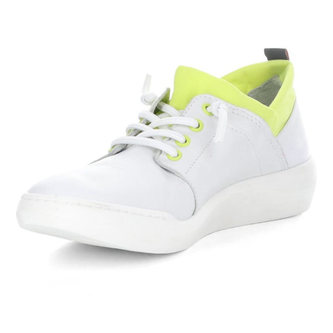 Inner front view of the softino byra sneaker. This sneaker is white with a neon green layer of fabric around the opening. The shoes has non-functional white laces.