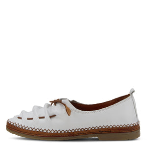 Inner side view of the Spring Step Berna Slip-On Shoe. This closed-toe shoe is flat and white with brown stitching and a brown elastic vamp with a brown tie.