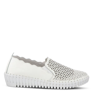 Outer side view of the spring step sasze sneaker. This all white slip on sneaker has a wedge heel, scalloped/wavy edges, and a laser-cut designed front.