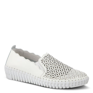 Outer front side view of the spring step sasze sneaker. This all white slip on sneaker has a wedge heel, scalloped/wavy edges, and a laser-cut designed front.