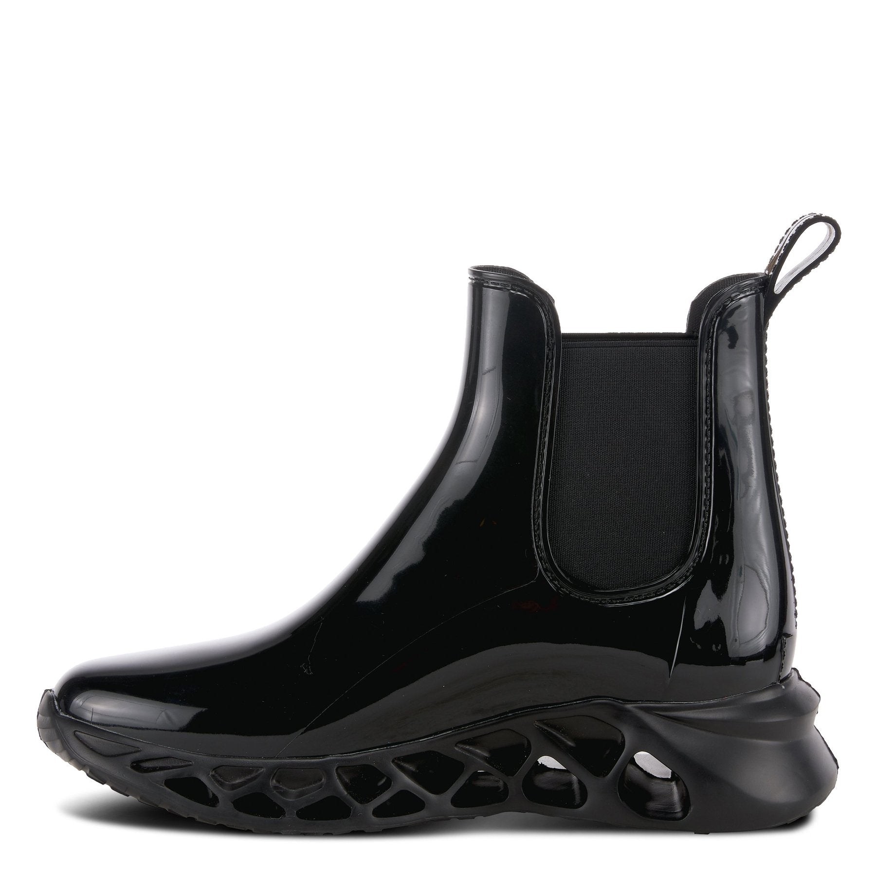 Inner side view of the yasmine boot. This black boot is rubber with elastic side gores and rubber soles with holes.
