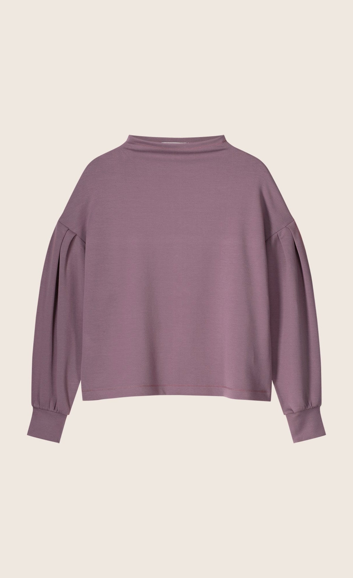 Front view of the summum scuba pullover. This pullover is mauve colored, has drop shoulders, long puff sleeves, and cuffs. The top also has a boat neck.