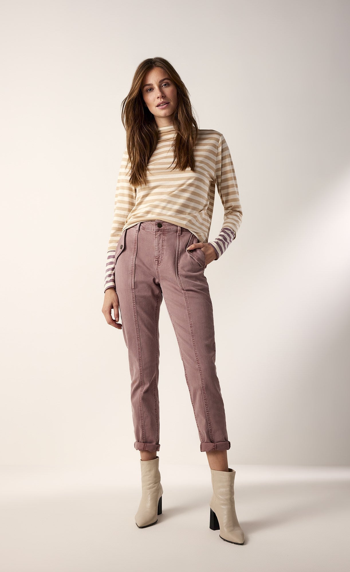 front full body view of the summum striped tone-on-tone shirt. This top has neutral brown stripes with contrasting wine stripes on the end of the long sleeves. The top also has a slight funnel neck.