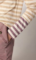 Load image into Gallery viewer, front close up view of the summum striped tone-on-tone shirt. This top has neutral brown stripes with contrasting purple stripes on the end of the long sleeves. The top also has a slight funnel neck.
