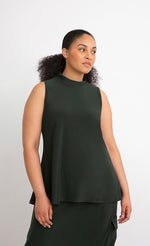 Load image into Gallery viewer, Front top half view of a woman wearing the Sympli Mock Neck Tank in the color seaweed. This top is dark green, sleeveless, and features a mock neck.
