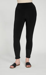 Load image into Gallery viewer, Bottom half front view of the sympli motion trim cuff legging. This legging is black with a ribbed cuff that has a tiny side slit.
