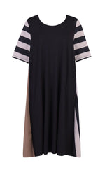 Load image into Gallery viewer, Front view of the alembika tekbika stripe dress. This dress is black with one brown side, one striped side, and striped elbow length sleeves. The dress sits at the knees.
