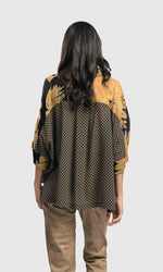 Load image into Gallery viewer, Back top half view of a woman wearing the alembika Lei Floral-Yoked Chiffon Blouse.
