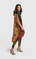 Load image into Gallery viewer, Right side full body view of a woman wearing the Alembika Miz Avery oversized tunic.
