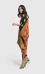 Load image into Gallery viewer, Left side full body view of a woman wearing the Alembika Miz Avery oversized tunic.
