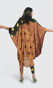 Back full body view of a woman wearing the Alembika Miz Avery oversized tunic.