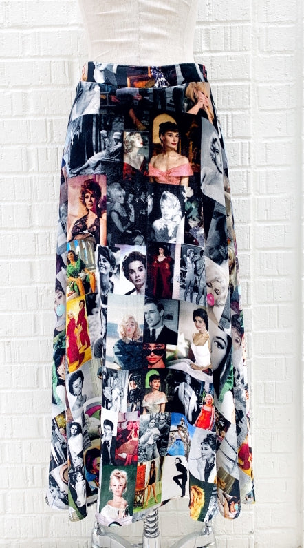 back view of the long unbreakable evolution gio skirt in the black and white print with hints of colors. This print features different images of stars from the 50s and 60s. 