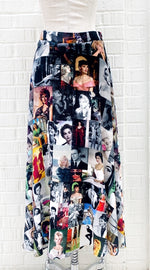 Load image into Gallery viewer, back view of the long unbreakable evolution gio skirt in the black and white print with hints of colors. This print features different images of stars from the 50s and 60s. 

