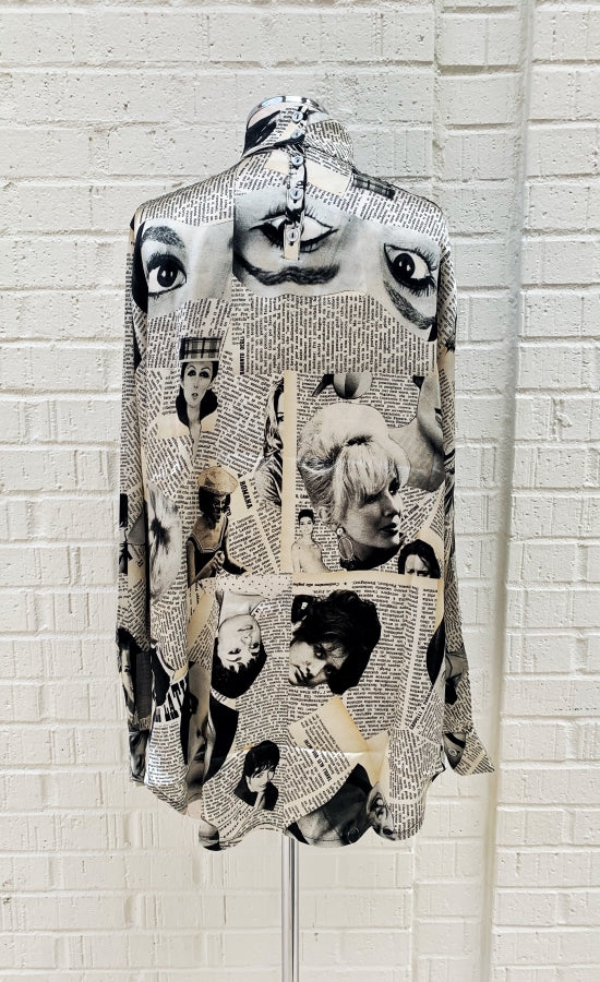 Back view of the unbreakable evolution petra blouse. This blouse is cream colored with a magazine cut out print all over it. It has long sleeves and a high neck.