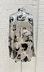 Load image into Gallery viewer, Back view of the unbreakable evolution petra blouse. This blouse is cream colored with a magazine cut out print all over it. It has long sleeves and a high neck.

