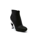 Load image into Gallery viewer, outer front side view of the united nude twirl bootie. This bootie is black with a metallic spiraling high heel.
