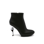 Load image into Gallery viewer, outer side view of the united nude twirl bootie. This bootie is black with a metallic spiraling high heel.
