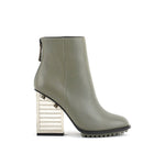 Load image into Gallery viewer, Outer side view of the united nude hi rise bootie. This bootie is grey with a glass like see-through, block shaped high heel. The bootie is an ankle bootie with a back zipper.
