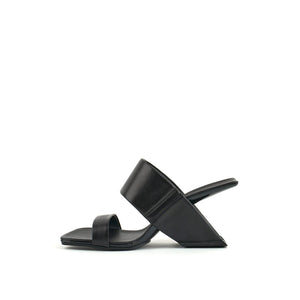 inner side view of the united nude loop hi sandal. This black square toed sandal is high-heeled and showcases a floating-like heel and two bands over the instep.  