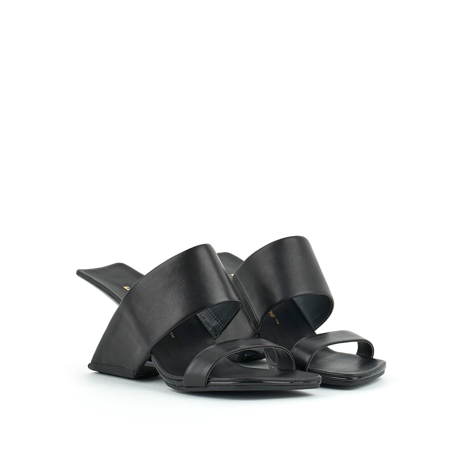 outer front side view of a pair of the united nude loop hi sandal. This black square toed sandal is high-heeled and showcases a floating-like heel and two bands over the instep.  