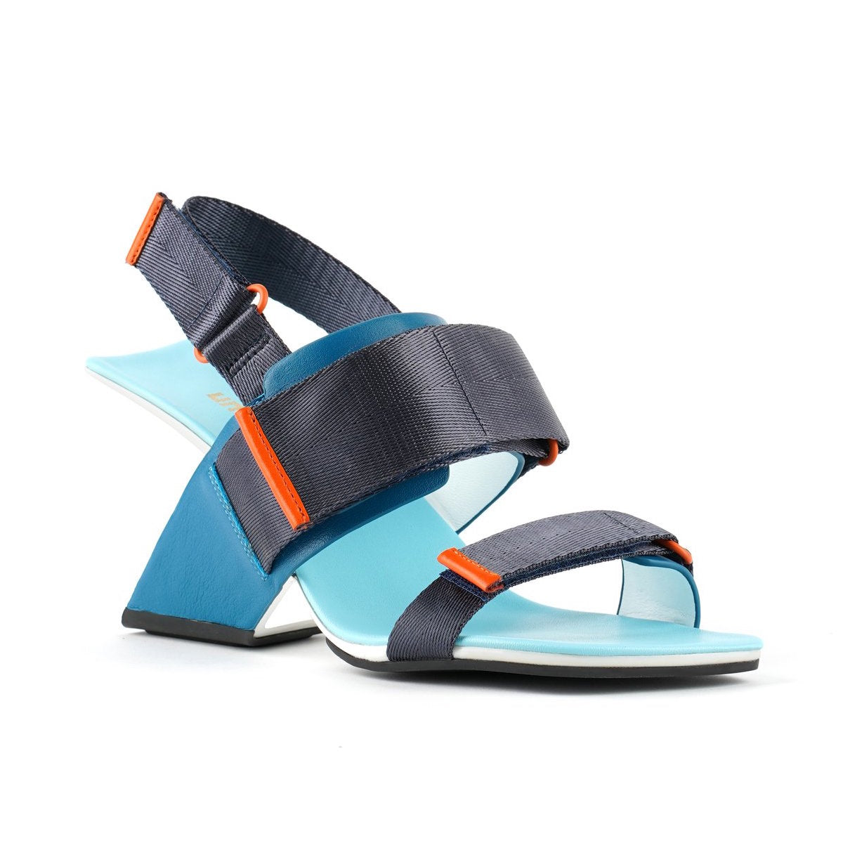 Outer front view of the united nude loop run high heel sandal. This sandal is blue with a black back strap, a black strap over the instep, and a black strap over the toes.