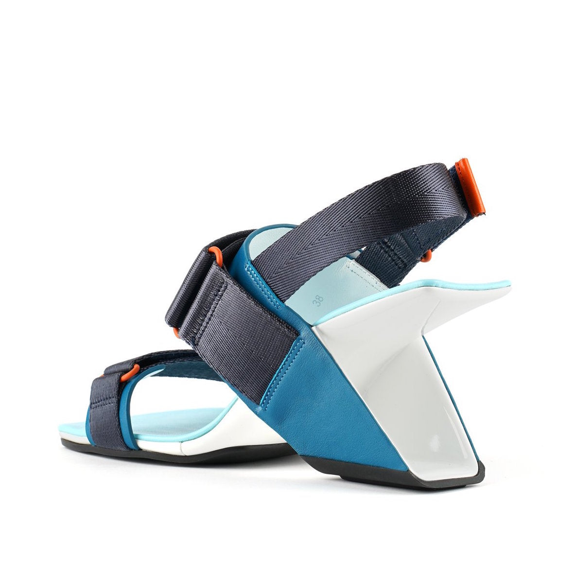 Inner back view of the united nude loop run high heel sandal. This sandal is blue with a black back strap, a black strap over the instep, and a black strap over the toes.