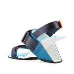 Load image into Gallery viewer, Inner back view of the united nude loop run high heel sandal. This sandal is blue with a black back strap, a black strap over the instep, and a black strap over the toes.
