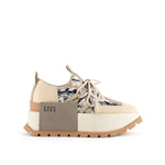 Load image into Gallery viewer, outer side view of the united nude roko hype sneaker in the color beige/natural. This sneaker has a wedge platform sole, a lace up front, a black and white geometric design, and a decorative square on the outer side with the United Nude logo.
