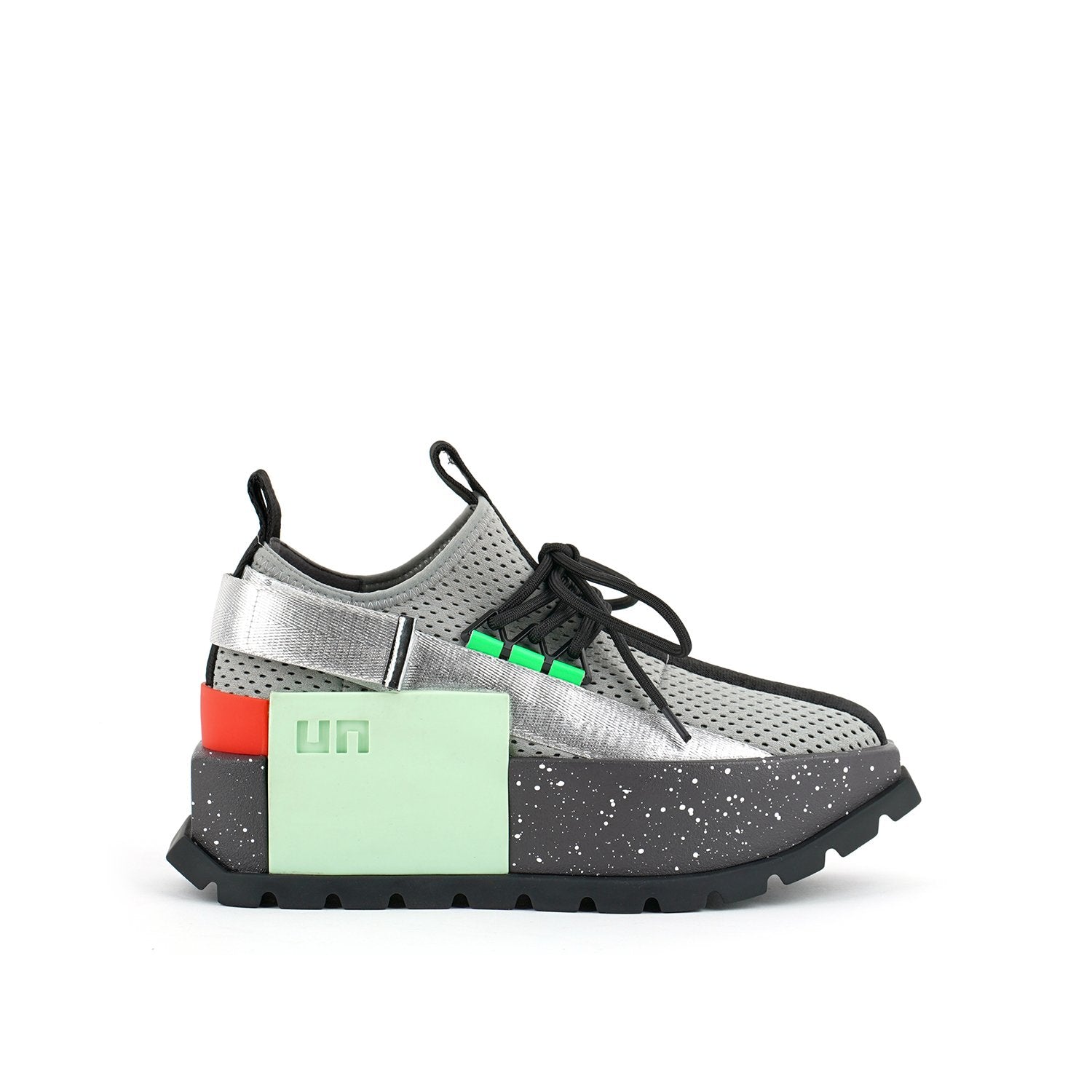 Outer side view of the united nude roko space sneaker. This sneaker sis grey with a platform sole. The upper is a mesh-like fabric. The shoes has a back strap and a lace up front.