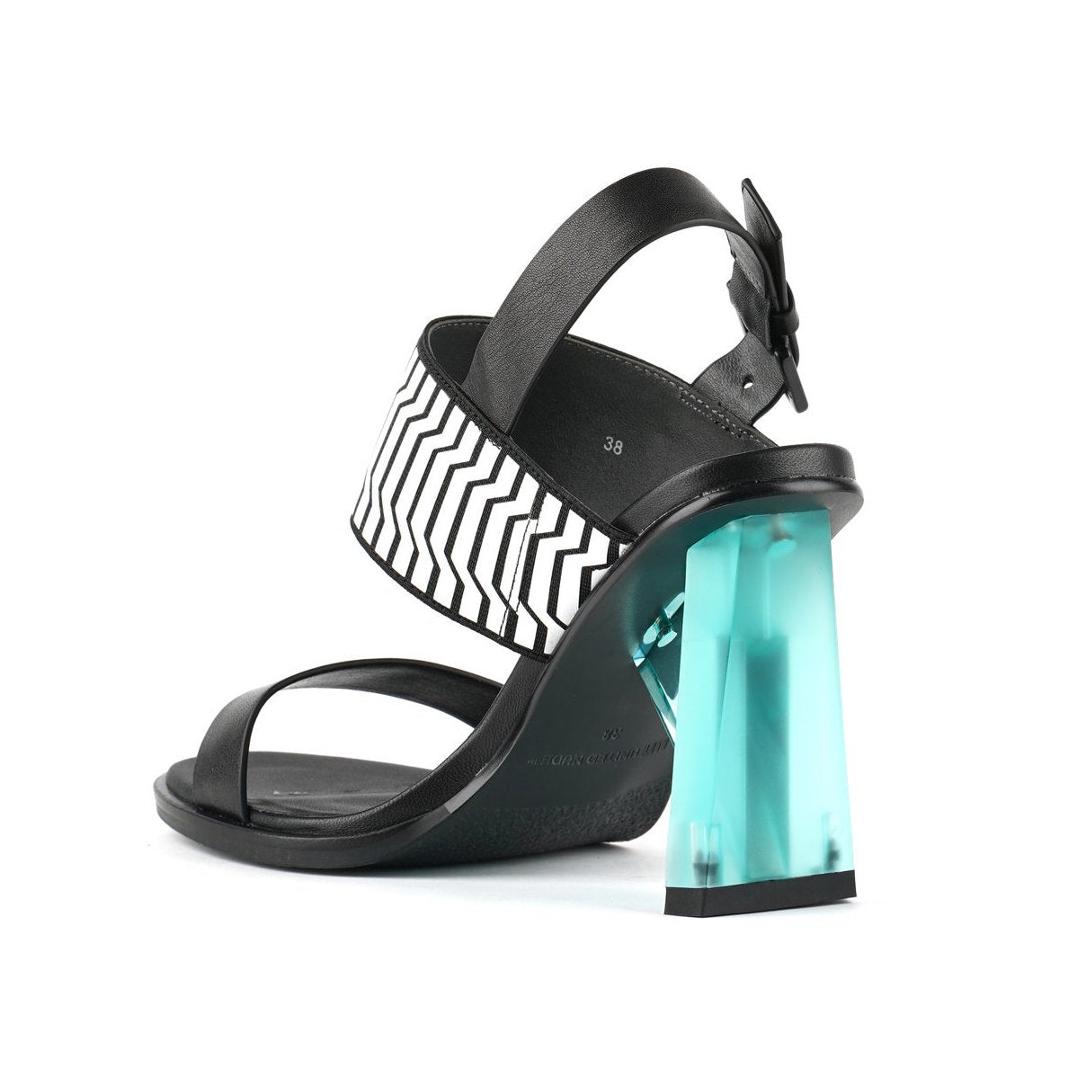 Inner back view of the united nude spark sandal hi II. This high heel has a strap over the instep and a strap over the toes. This shoe is black with a blue heel and it has an adjustable buckle strap behind the heel.