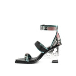 Load image into Gallery viewer, Inner side view of the united nude tool sandal in a coral and blue snake print. This high heel sandal has a tool-like heel and three straps - one over the toes, one over the instep, and one around the ankle.
