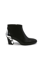 Load image into Gallery viewer, Outer side view of the black united nude twist flow bootie. This bootie has an almond toe and a silver stripe that runs from the back of the heel to the outer side of the heel
