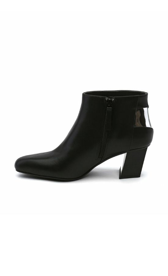 Inner side view of the black united nude twist flow bootie. This bootie has an almond toe, an inner zipper, and a silver stripe that runs from the back of the heel to the outer side of the heel