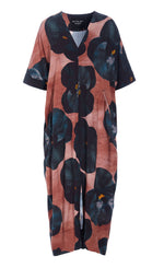 Load image into Gallery viewer, Front view of the bitte kai rand black hibiscus long dress. This dress is pink with large black hibiscus flowers all over it. The long dress has elbow-length sleeves and a v-neck.

