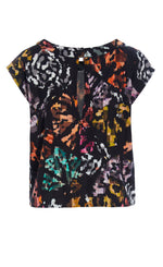 Load image into Gallery viewer, Back view of the bitte kai rand mosaic t-shirt. This short-sleeve top is black with a multicolored mosaic-like print on it. The back has a button and keyhole opening.
