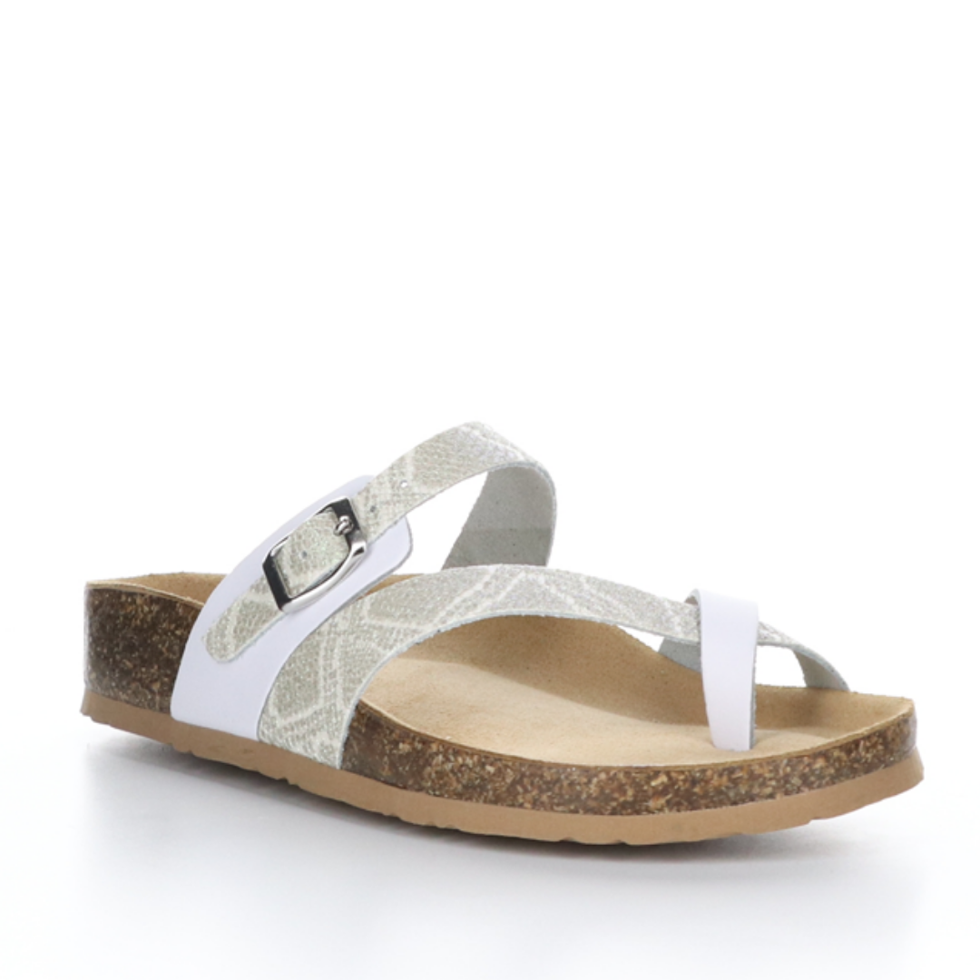 Outer front view of the bos & co parr sandal. This sandal has a strap across the instep and a strap that creates a toe loop. The straps are a mix of solid white and white glitter snake print.