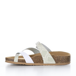 Load image into Gallery viewer, Inner view of the bos &amp; co parr sandal. This sandal has a strap across the instep and a strap that creates a toe loop. The straps are a mix of solid white and white glitter snake print.
