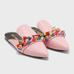 Load image into Gallery viewer, Front view of a pair of the kat maconie issa mule. This slip on mule is pink with multicolored tiny pyramid shaped decorations on the upper. The shoe has a pointed toe.
