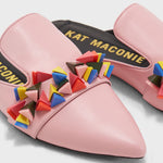 Load image into Gallery viewer, Close up view of a pair of the kat maconie issa mule. This slip on mule is pink with multicolored tiny pyramid shaped decorations on the upper. The shoe has a pointed toe.
