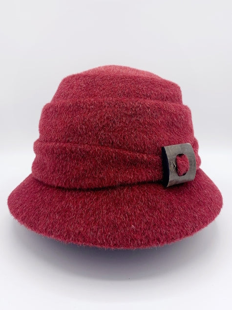 Front view of the lillie & cohoe mohair Freda hat. This hat is red with a tiered crown and a front decorative wooden buckle/button
