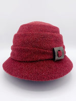 Load image into Gallery viewer, Front view of the lillie &amp; cohoe mohair Freda hat. This hat is red with a tiered crown and a front decorative wooden buckle/button
